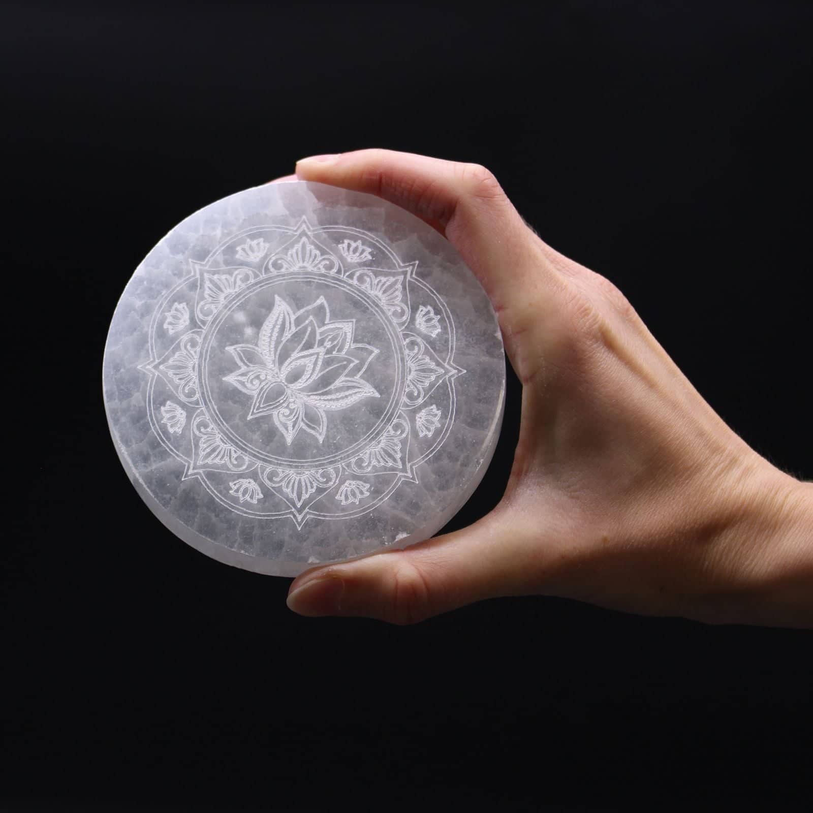 Close-up of the lotus mandala carving on the selenite