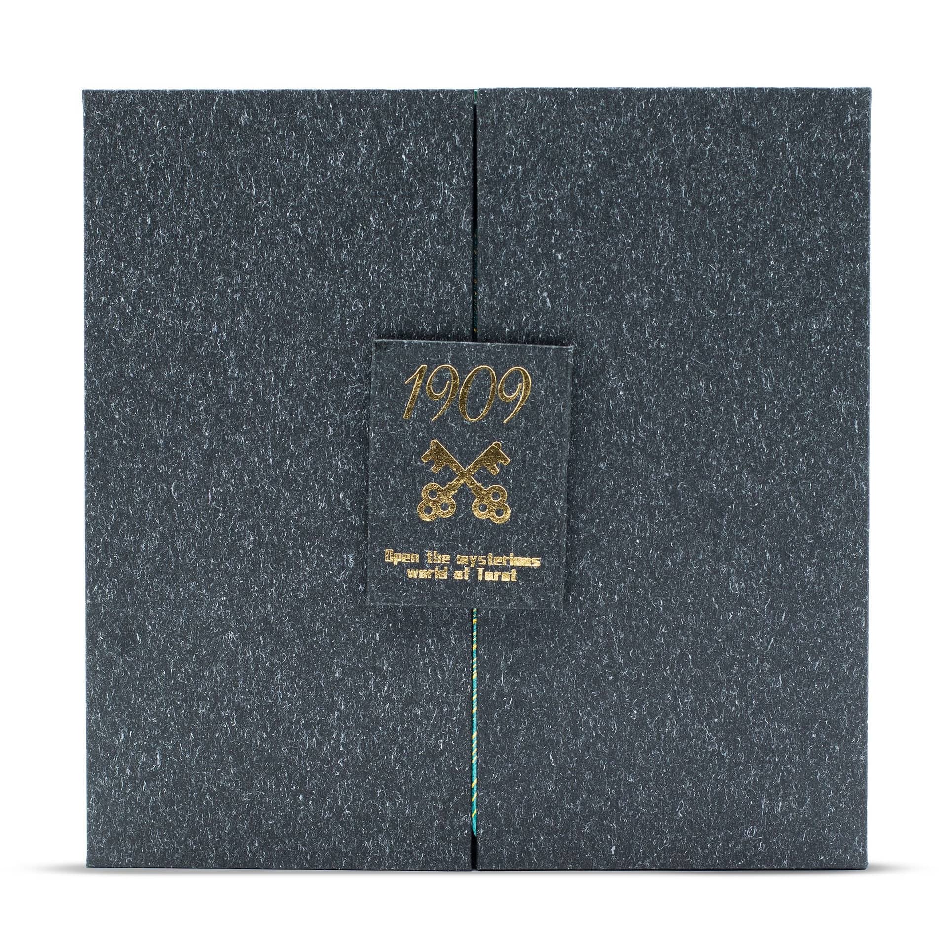 Close-up of gold and turquoise foil detail on a tarot card