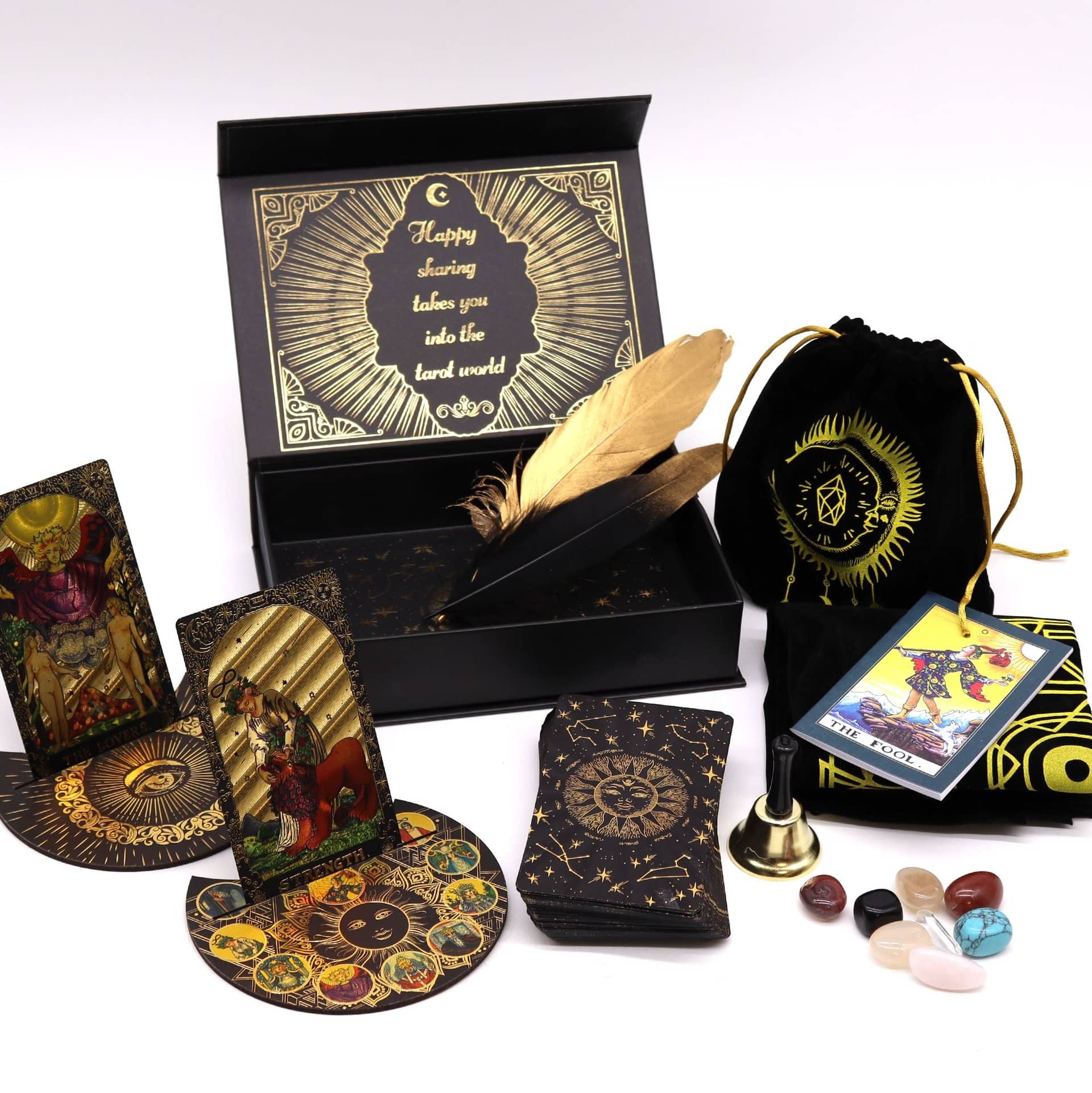 Gold foil tarot cards on a celestial tarot cloth with card stands
