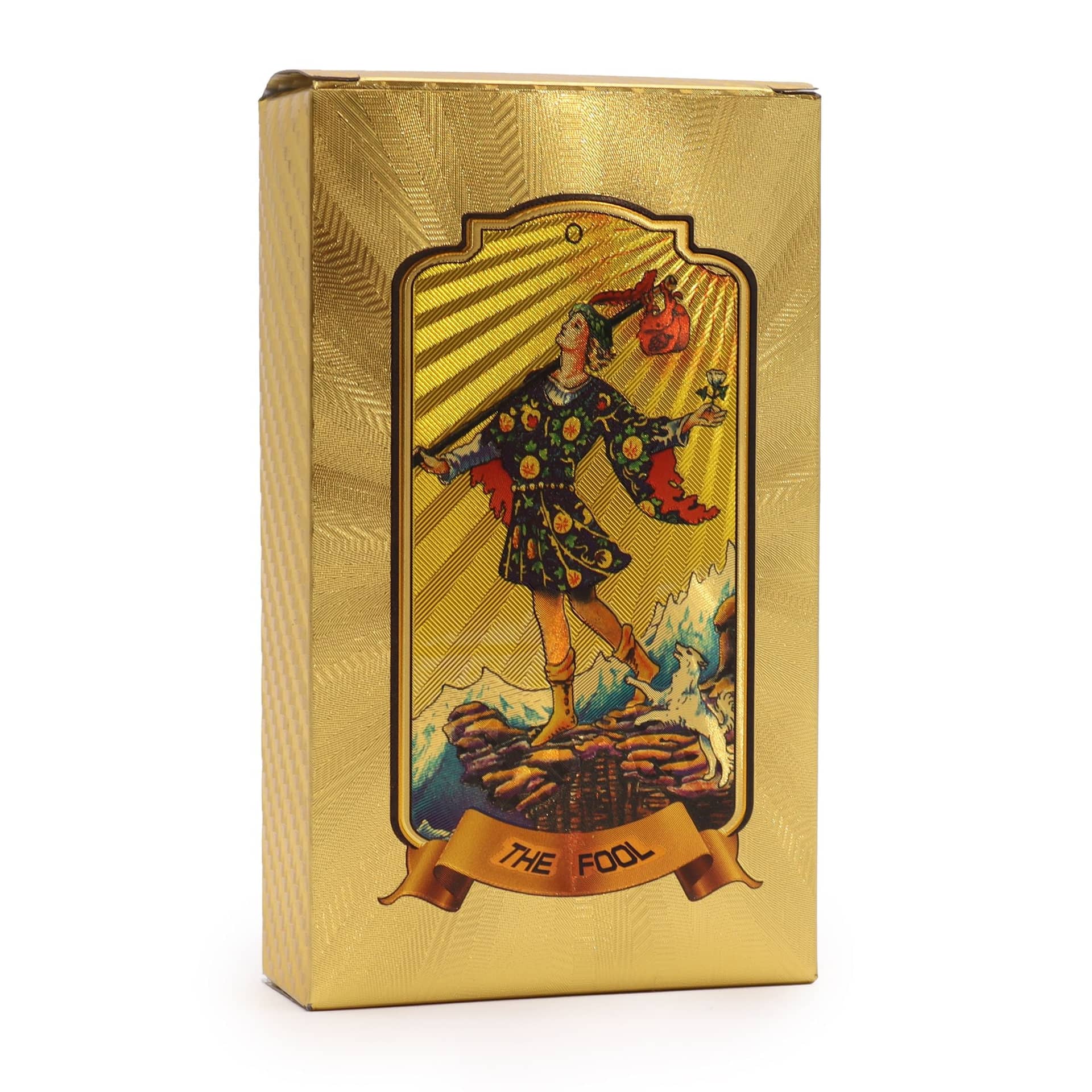 Golden tarot cards fanned out beside their gold box