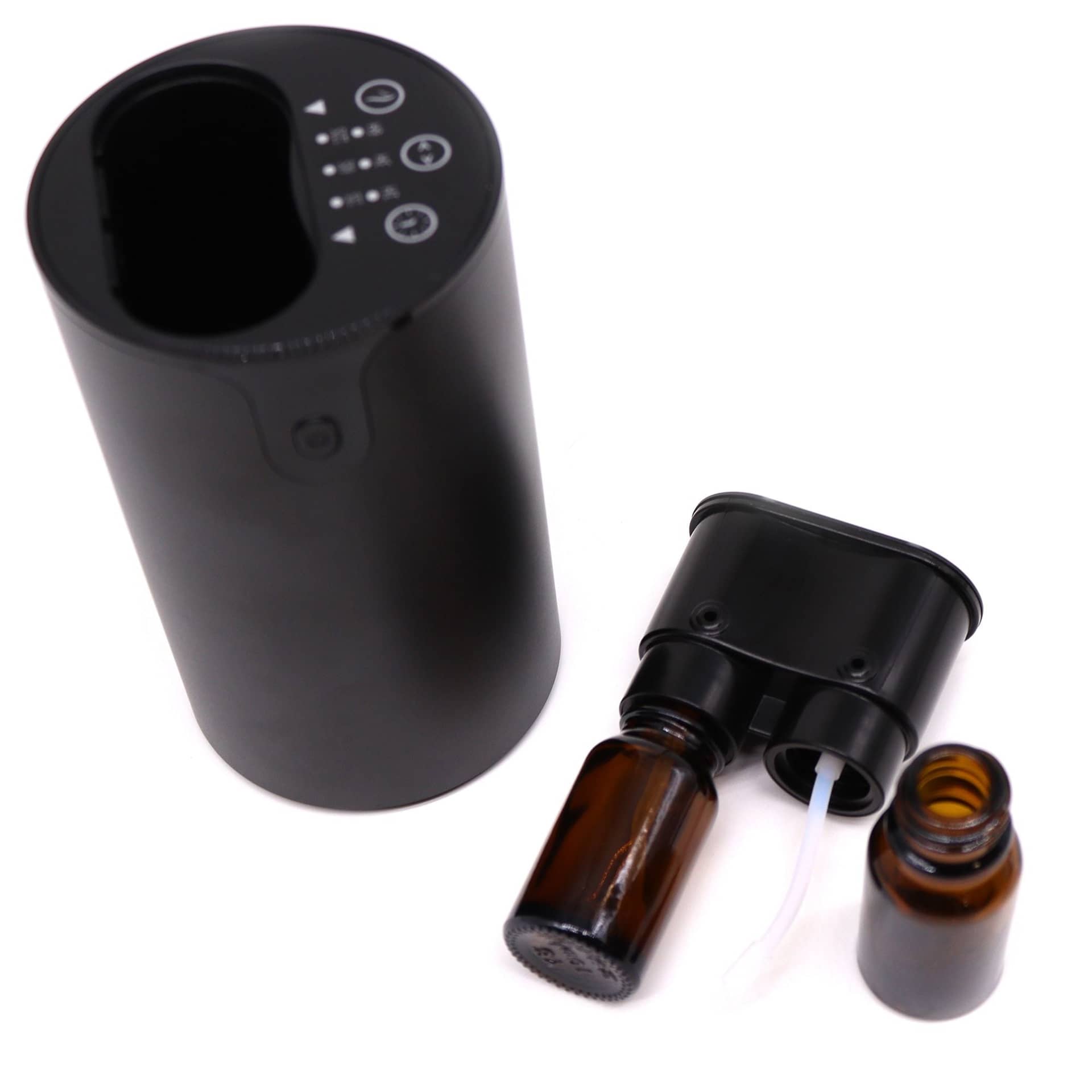 Essential oil nebuliser on a bedside table