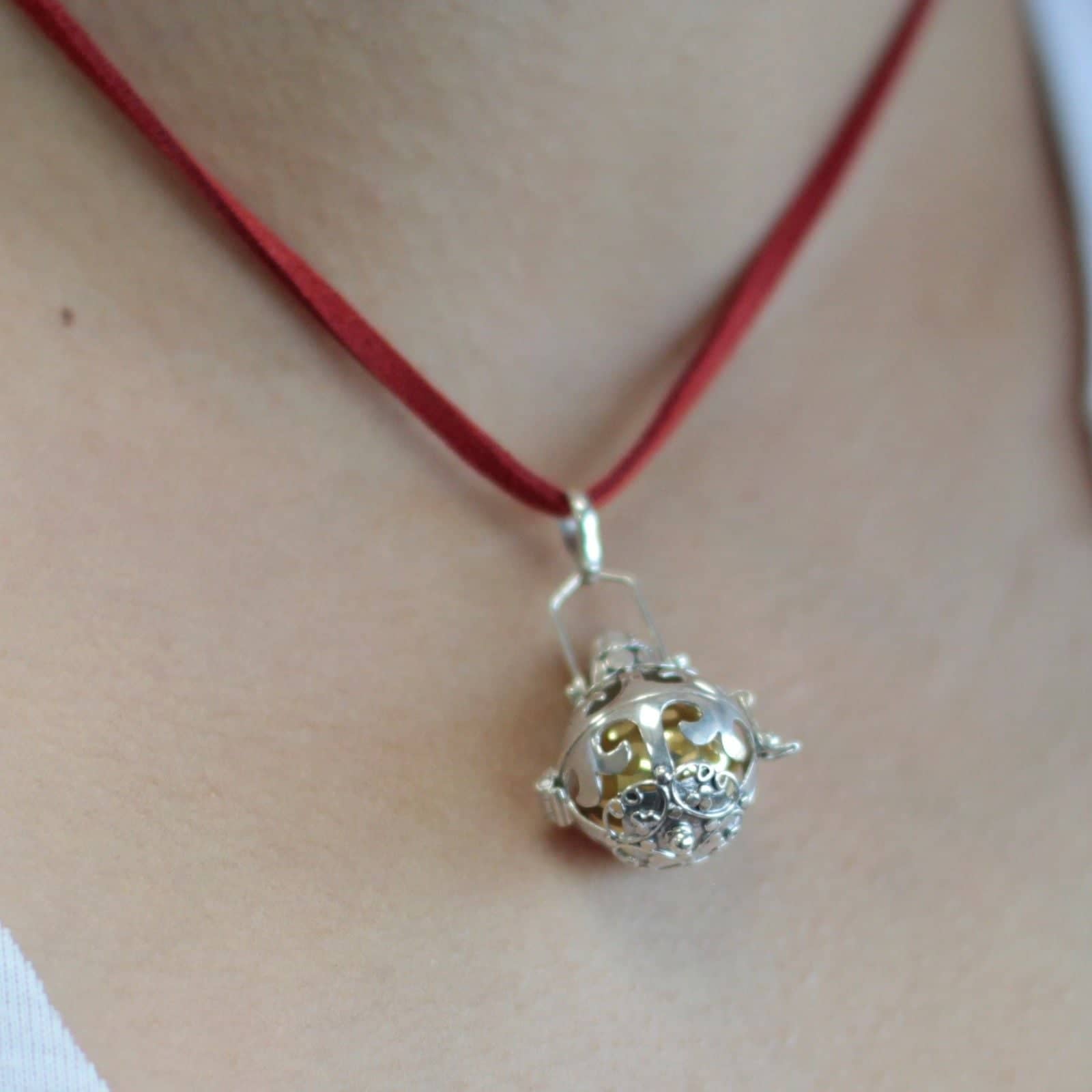 Sterling silver angel bell pendant on a neck cord, 18mm