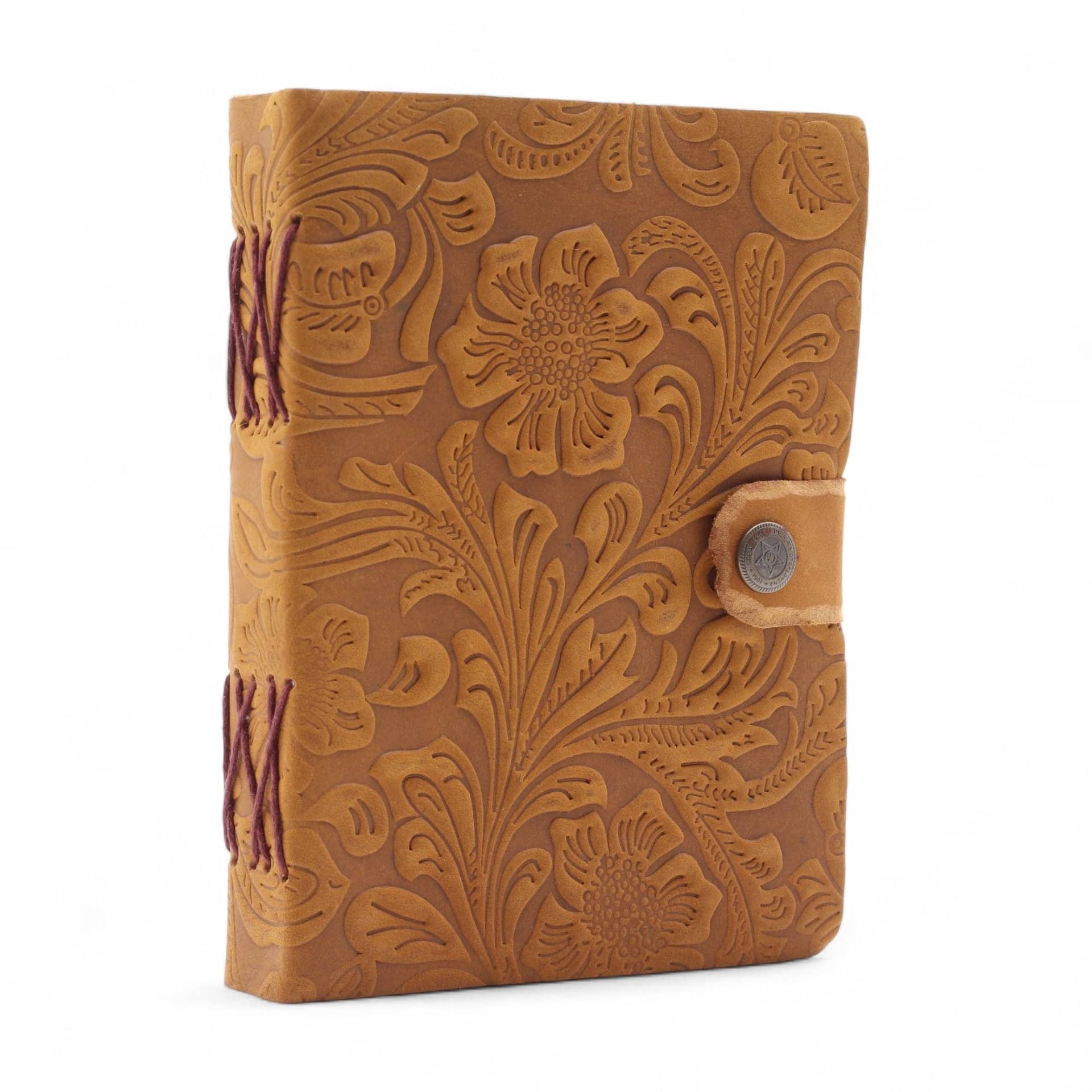 Tan embossed leather notebook with floral pattern