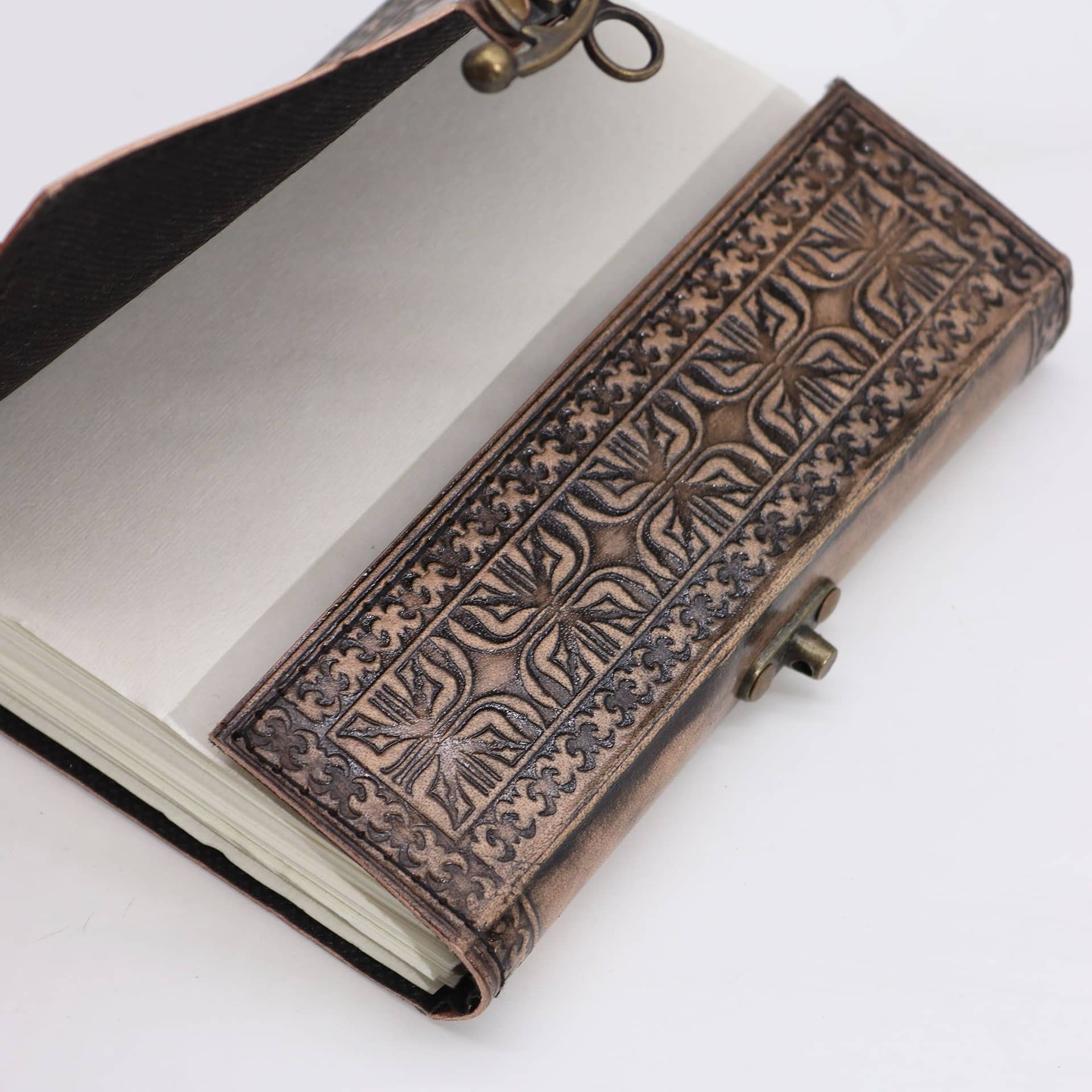 Close-up of the lotus mandala design on the leather cover