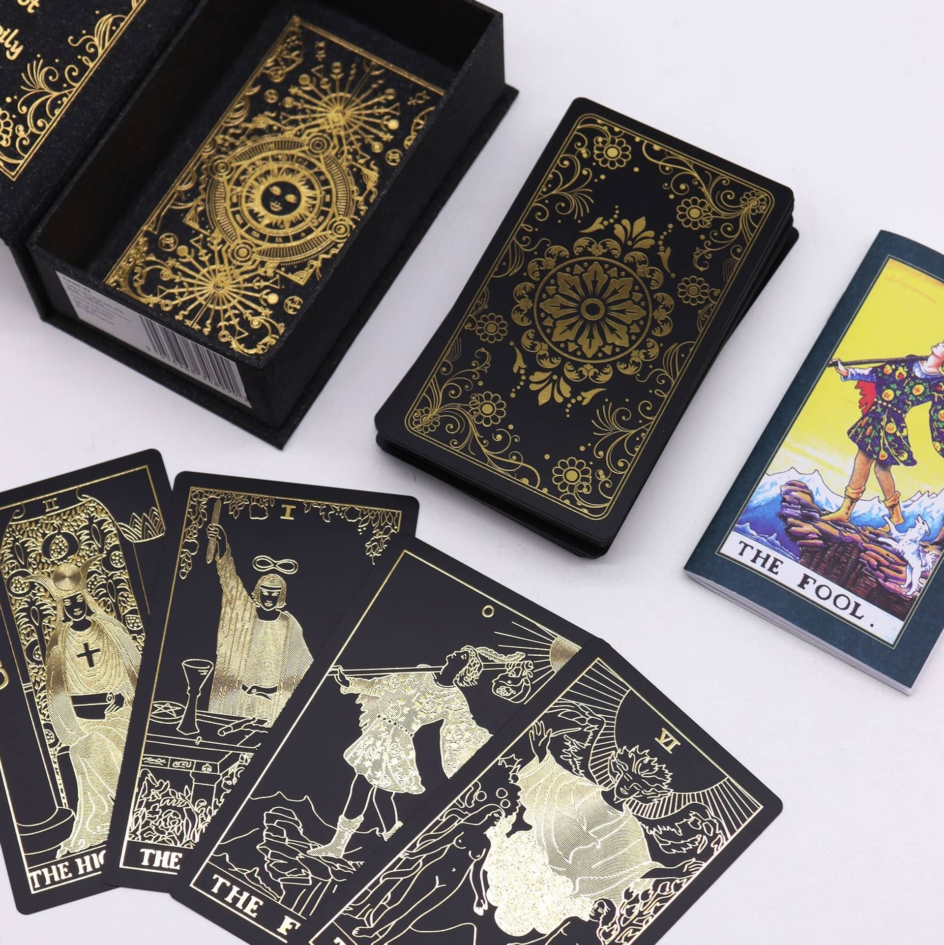 Close-up of black and gold foil tarot cards