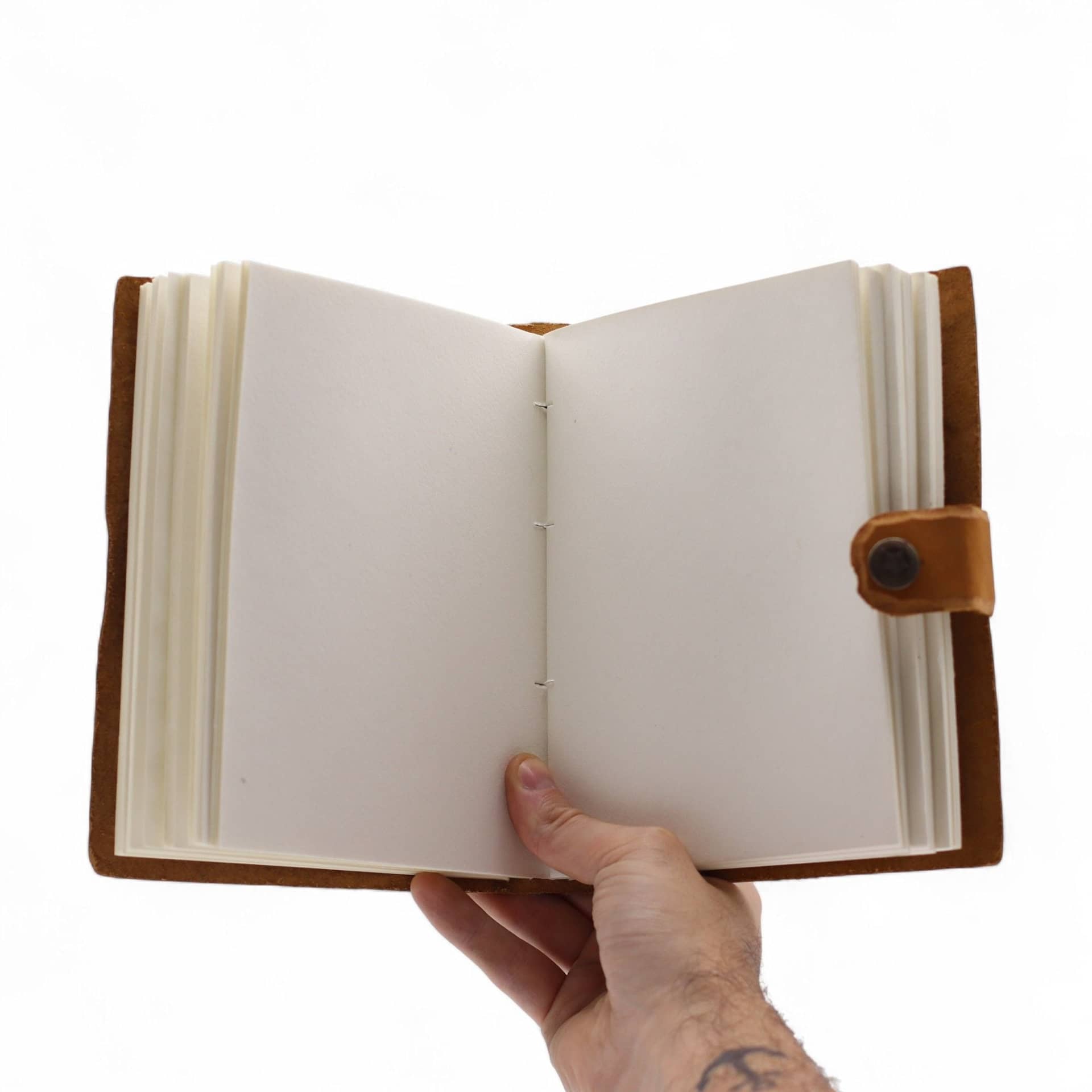 Leather notebook open flat on a desk