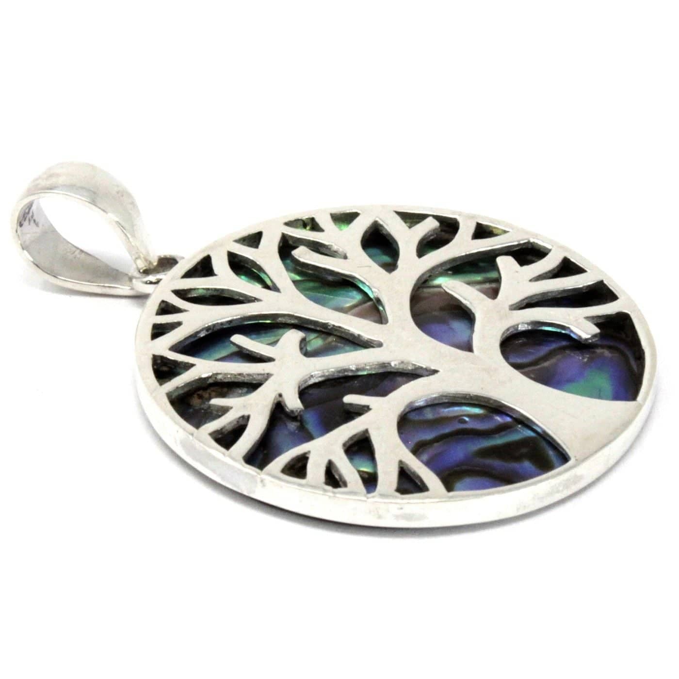 Close-up of the shimmering abalone behind the tree design