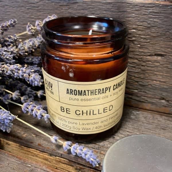 Be Chilled aromatherapy candle in an amber glass jar