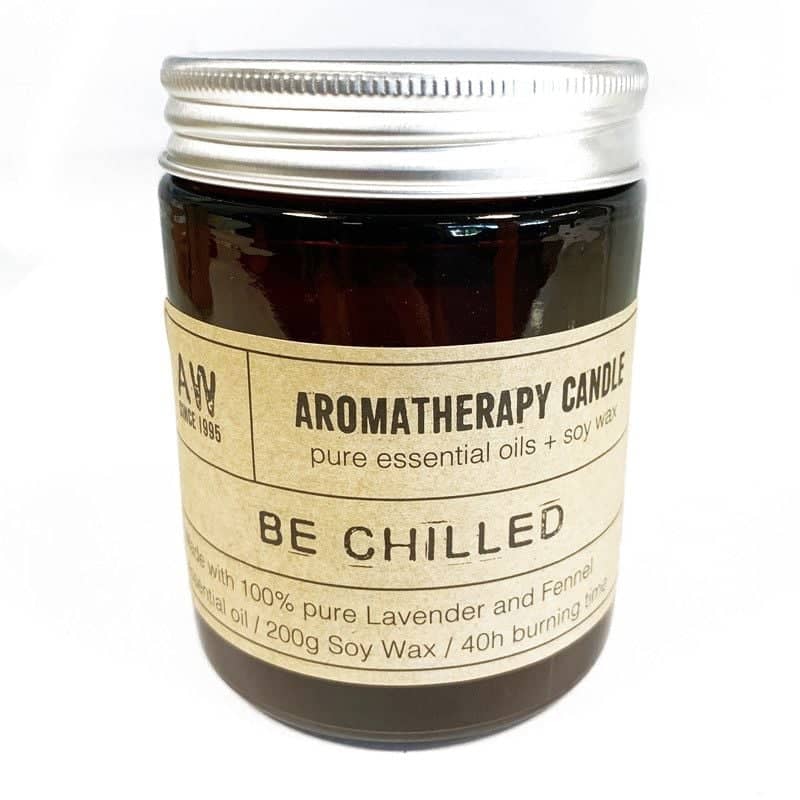 Soy wax candle beside its kraft gift box
