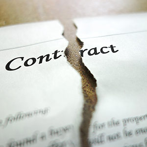 Relationship philosophy - Contract torn down the middle, lying on a desk