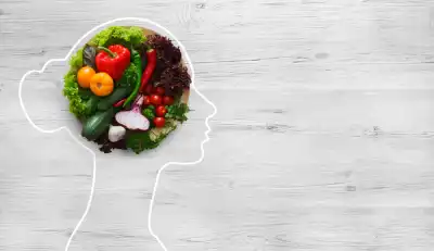 The outline of a head and neck with the brain section filled with fruit and vegetables