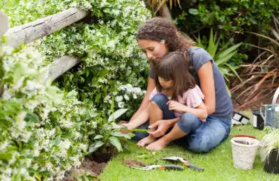 Mum and daughter gardening together