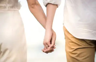 married couple holding hands