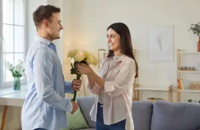 Image of a man giving a woman flowers.