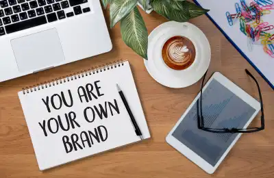Image of a notebook that says 'you are your own brand.'