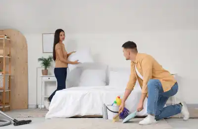 Image of a couple cleaning together.