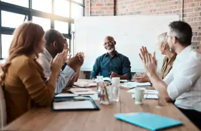 smiling team in meeting