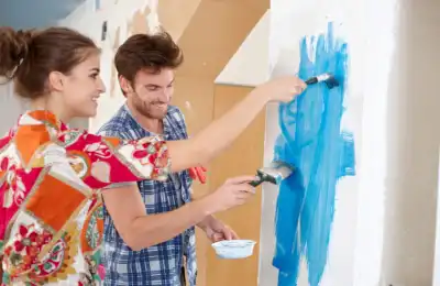 Image of a couple painting together.
