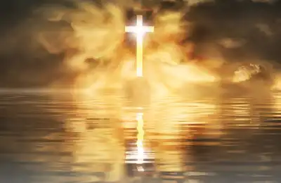 Christian Cross reflected in water