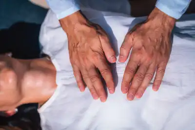 Two hands on someone's heart
