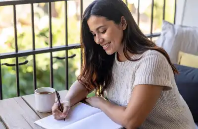 Image of someone journaling.
