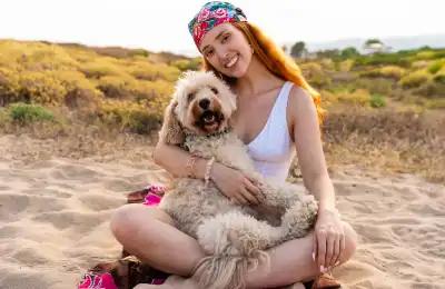 Lady hugging her dog