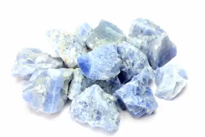 Multiple pieces of Blue Calcite on a white background