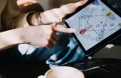 Someone pointing to numerology on their tablet
