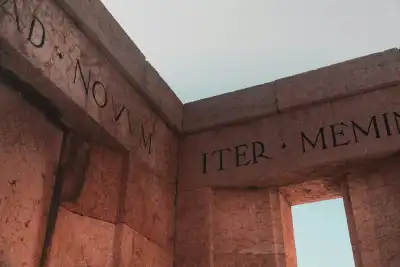 Latin written on the corner of a building. 