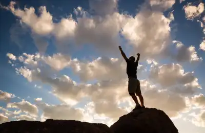 An image of someone standing on top of a mountain.