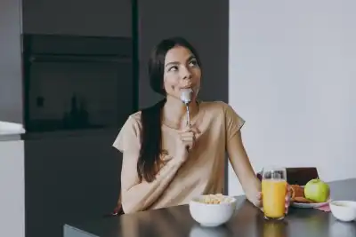 A woman sat at a table eating
