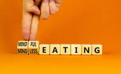 Blocks spelling out eating, with two that say mindless being changed to mindful