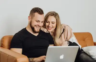 Image of a couple sitting together on the couch.