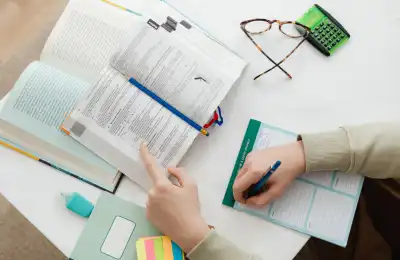 Image of someone using a textbook to learn.
