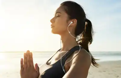 woman praying and visualising on the beach