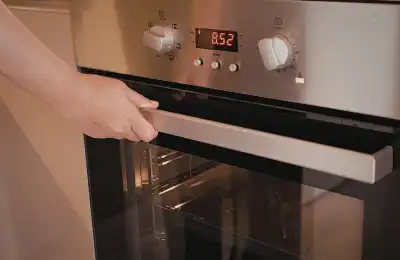 person about to open oven door