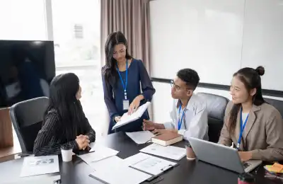 woman leading team in office