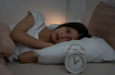 Woman struggling to sleep
