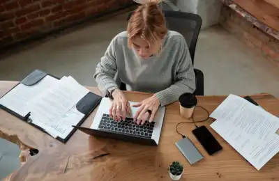 woman working on laptop at desk