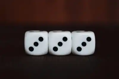 Three dice all showing the number three