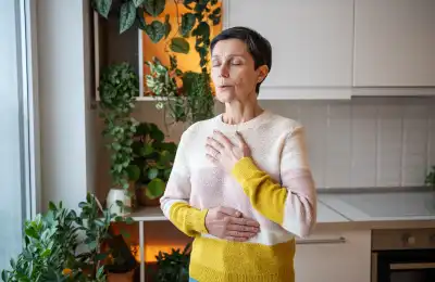 woman doing mindful breathwork in kitchen