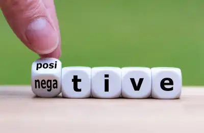 Image of someone turning the word negative into positive.
