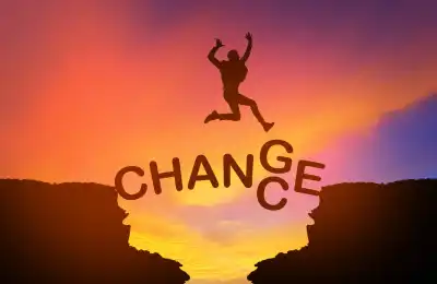 An image of someone jumping over the word 'change' 