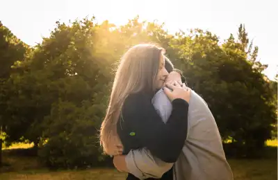 couple hugging in park
