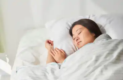 Image of a woman asleep, dreaming.