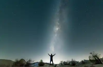 Image of someone looking up at the stars.