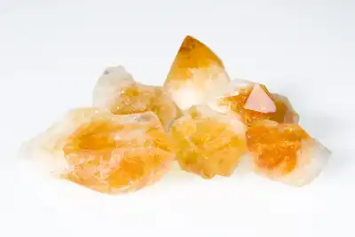 Multiple pieces of Citrine on a white background