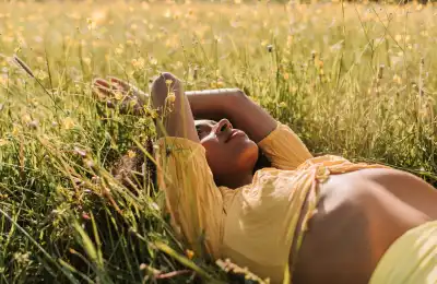 intuitive woman lying in field