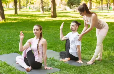 Image of someone teaching yoga outside.