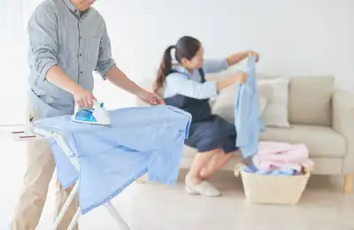 Image of a couple doing laundry together.